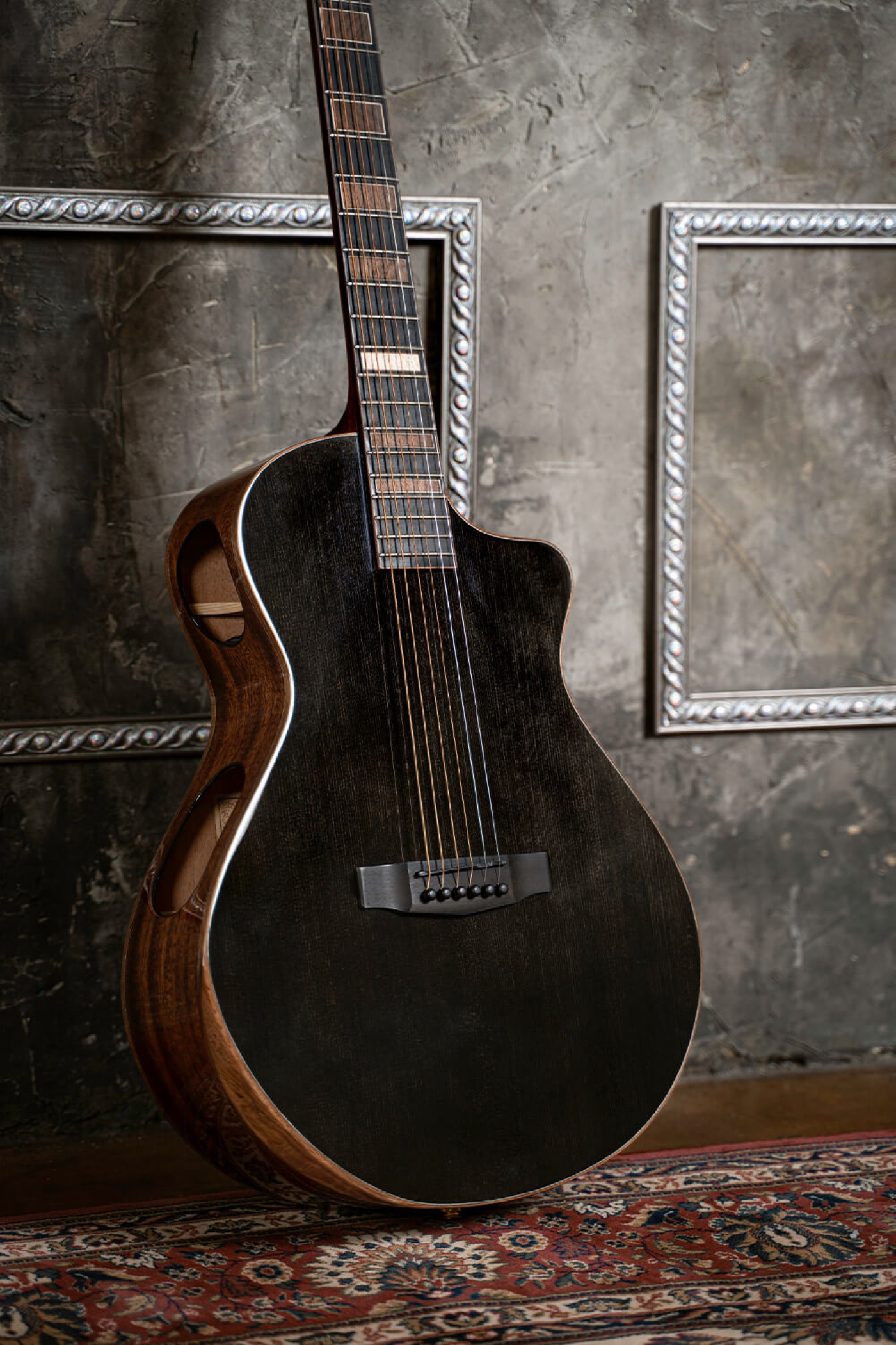 Image of Cort masterpiece modern black acoustic electric guitar lifestyle 3