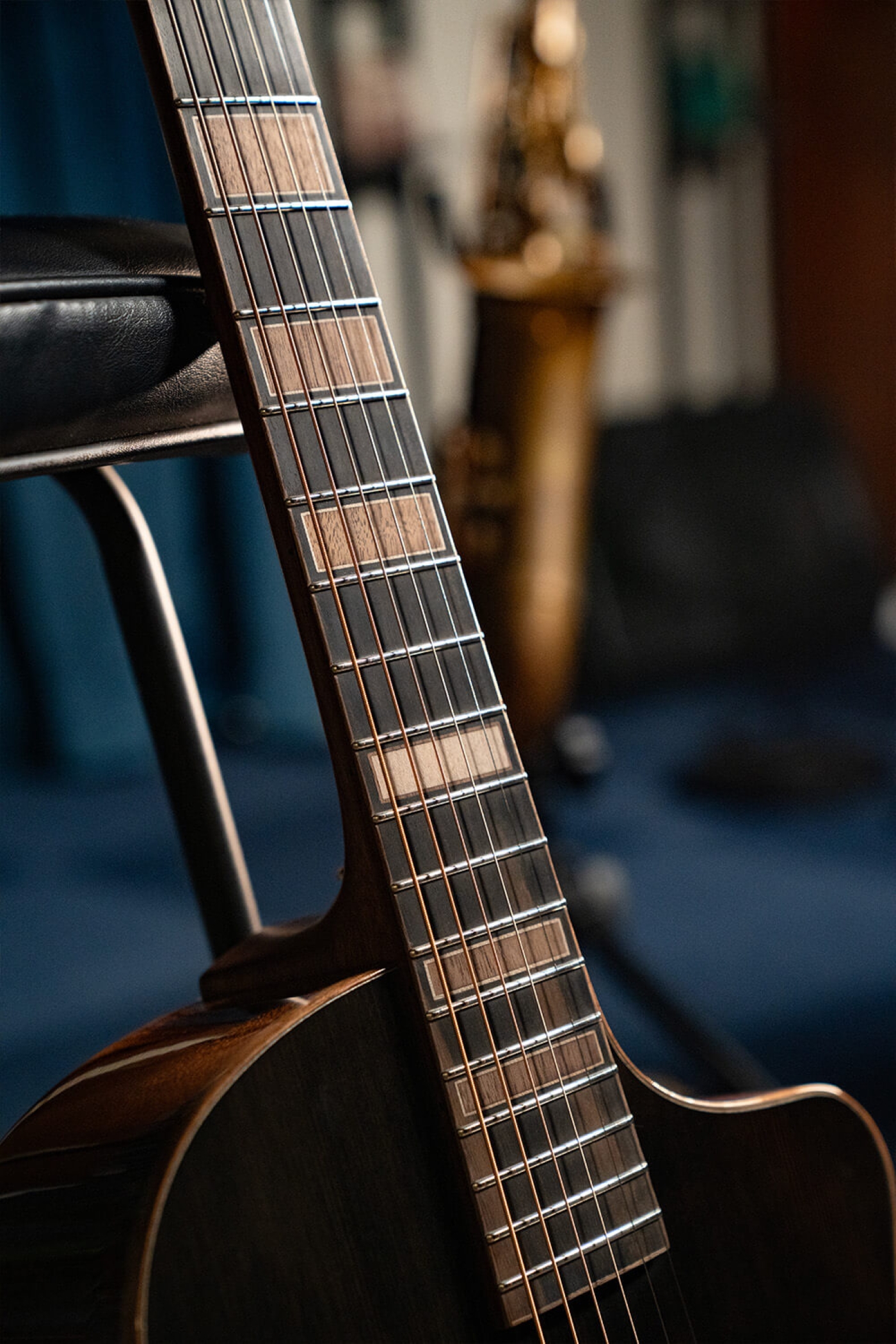 Image of Cort masterpiece modern black acoustic guitar lifestyle 1