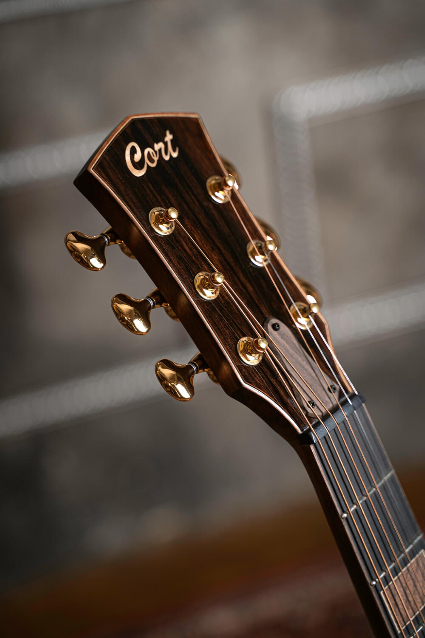 Image of Cort masterpiece modern black acoustic electric guitar lifestyle 4